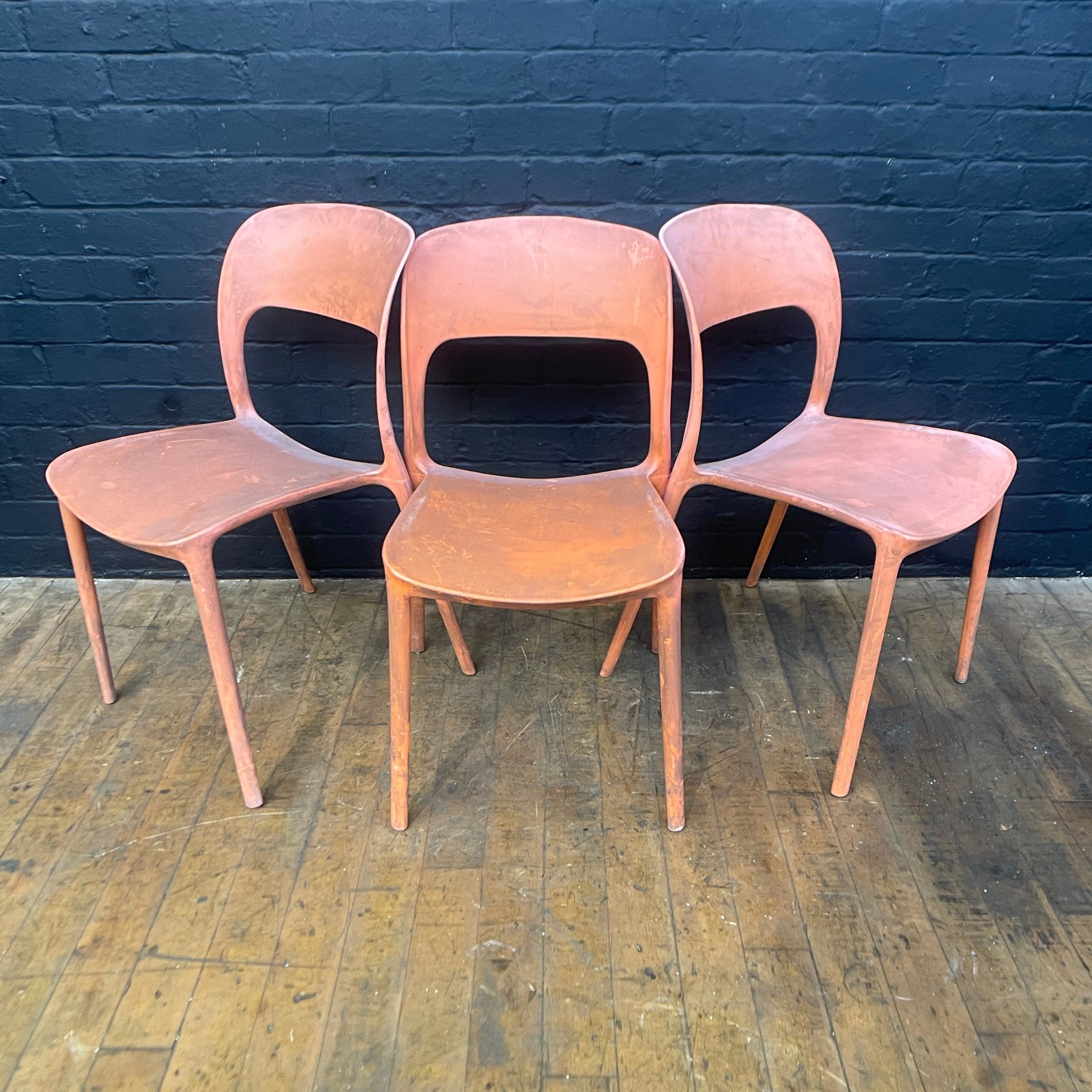 stackable plastic chairs orange Industrial powerhouse props prop rental hire vintage movie film set dec