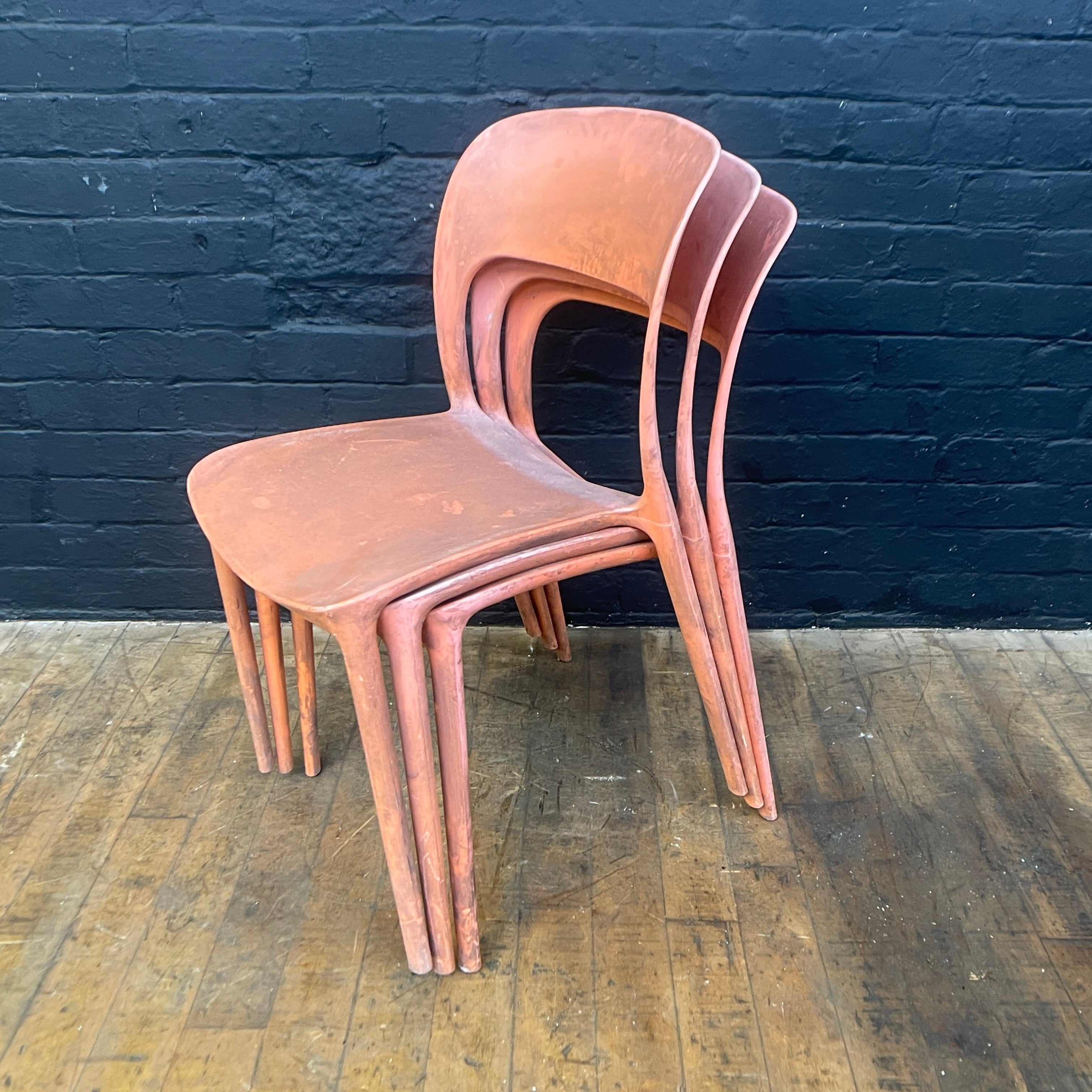 stackable plastic chairs orange Industrial powerhouse props prop rental hire vintage movie film set dec 2