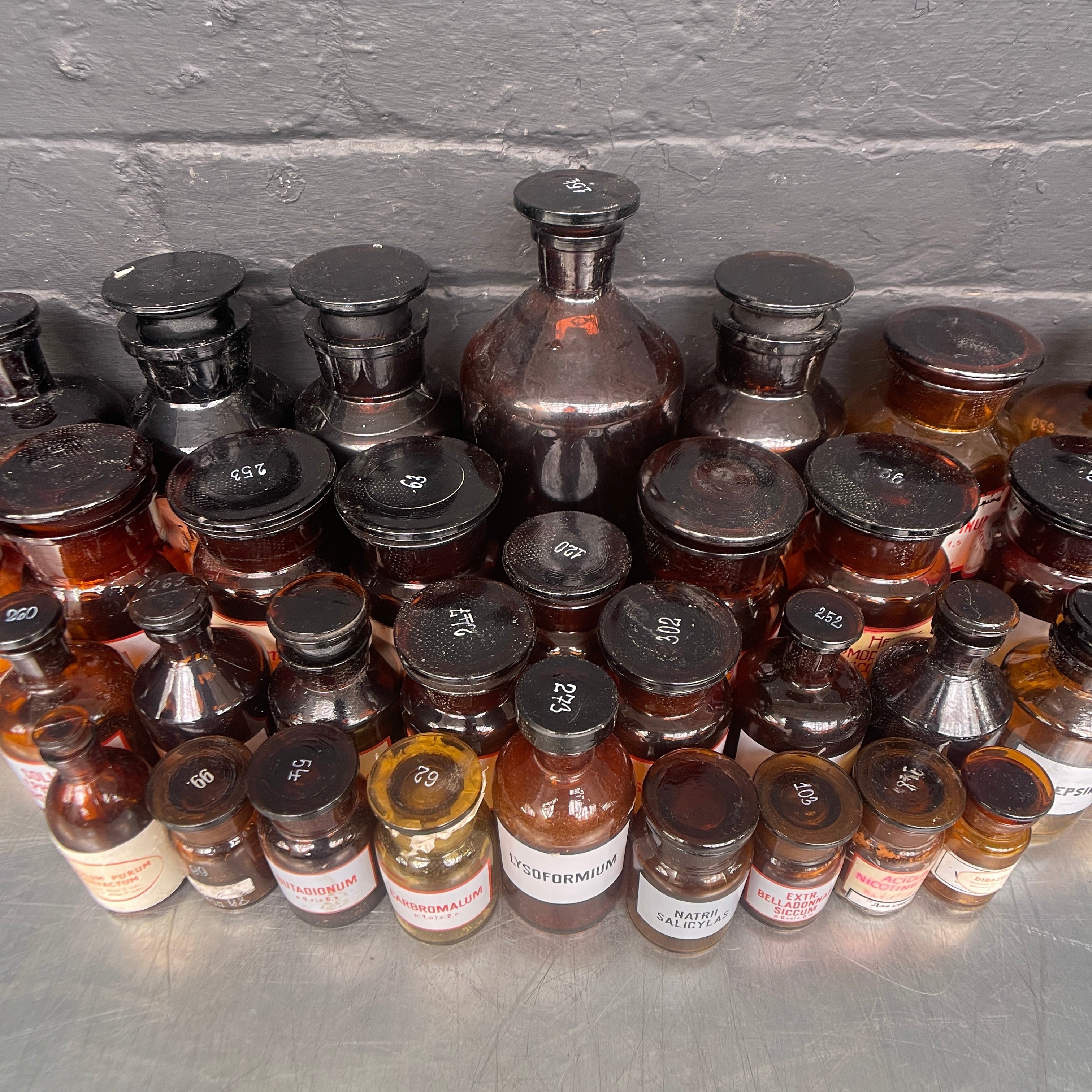 brown old vintage apothecary bottles chemist Industrial powerhouse props prop rental hire vintage movie film set dec 3