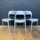 stackable plastic chairs grey Industrial powerhouse props prop rental hire vintage movie film set dec