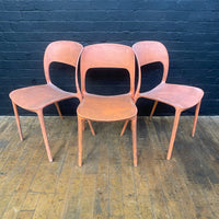 stackable plastic chairs orange Industrial powerhouse props prop rental hire vintage movie film set dec